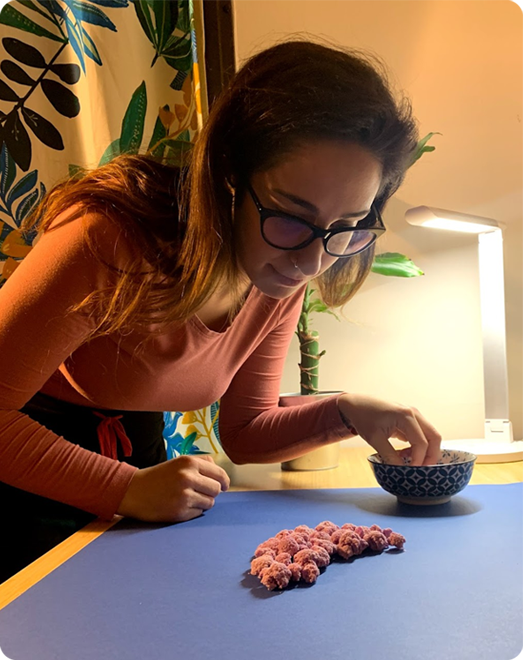 Laura arranging food to form a letter
